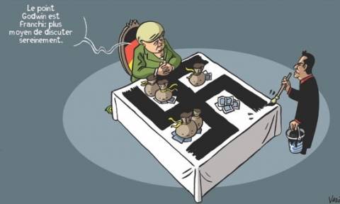 Σκίτσο της Liberation: Ο Τσίπρας ζωγραφίζει σβάστικα στο γραφείο της Μέρκελ