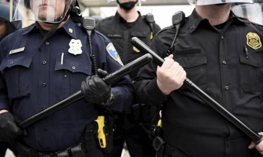 Baltimore to put cameras in police vans, review riot gear