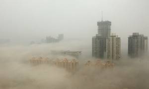 Κίνα: Η ατμοσφαιρική ρύπανση έφερε «πορτοκαλί συναγερμό» στο Πεκίνο