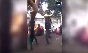 Σκληρό βίντεο: Απατημένος σύζυγος κρέμασε ανάποδα και μαστίγωσε τον εραστή της γυναίκας του