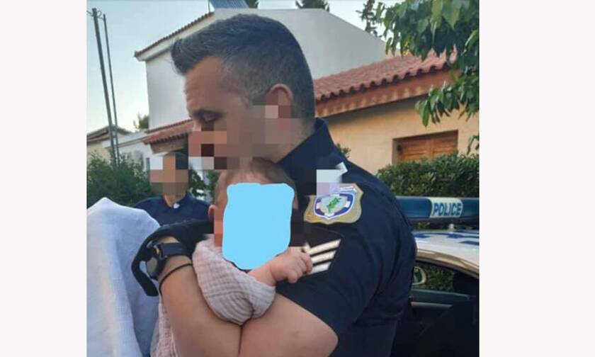 Γλυκά Νερά: Η ιστορία πίσω από τη συγκλονιστική φωτογραφία του αστυνομικού με το μωρό